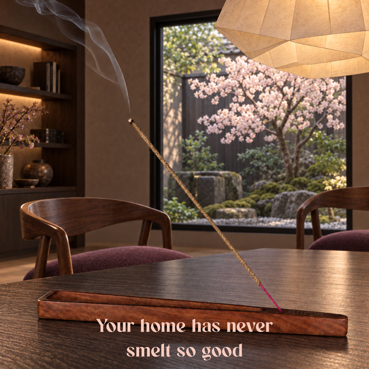 Sakura Al-Dar incense stick burning in a rosewood holder in a Japanese-style room overlooking cherry blossom trees
