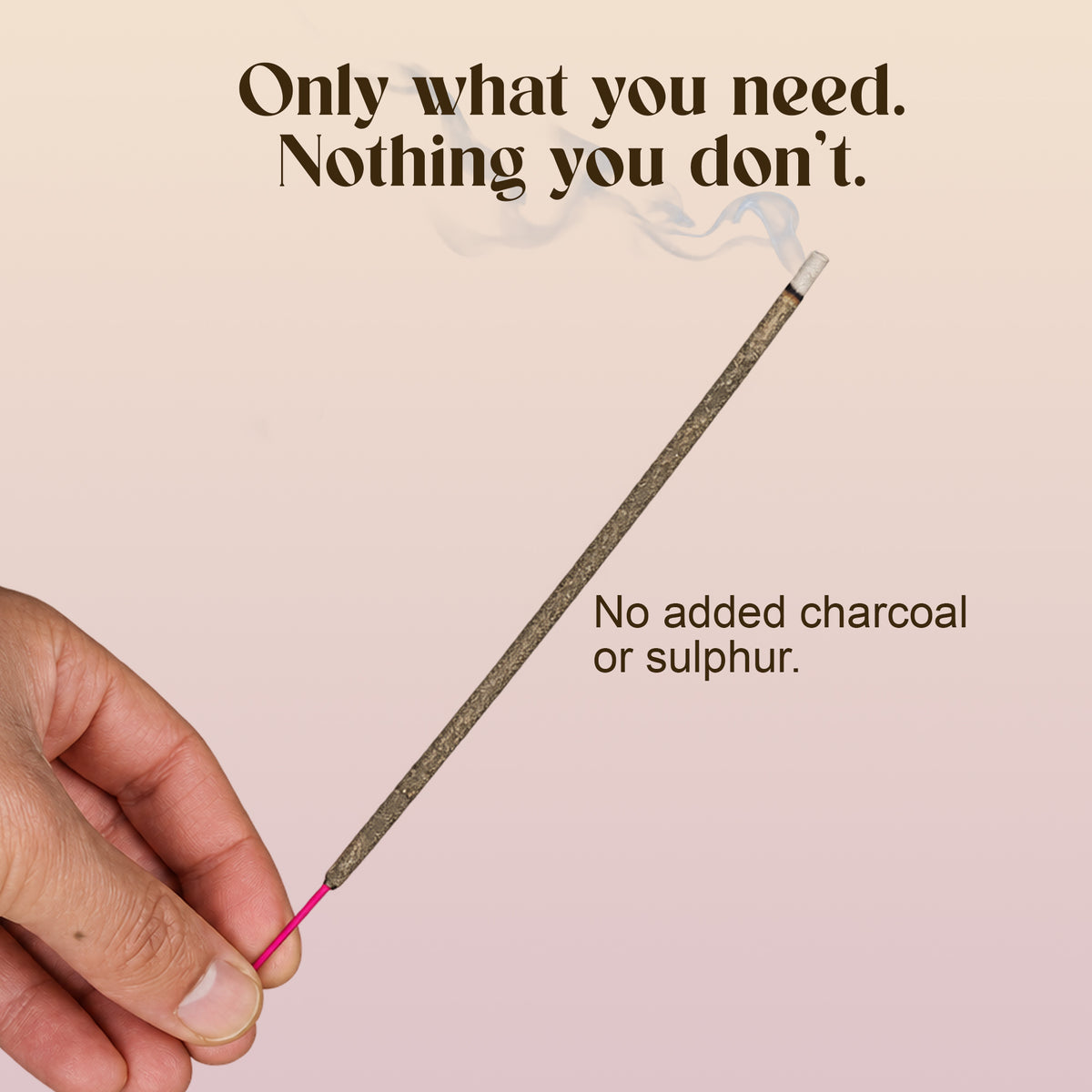 Hand holding a lit Sakura Al-Dar incense stick: no added charcoal or sulphur