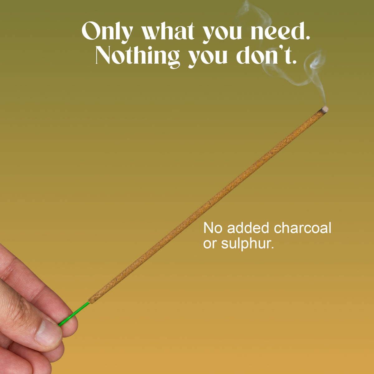 Hand holding a lit Maysara incense stick: no added charcoal or sulphur