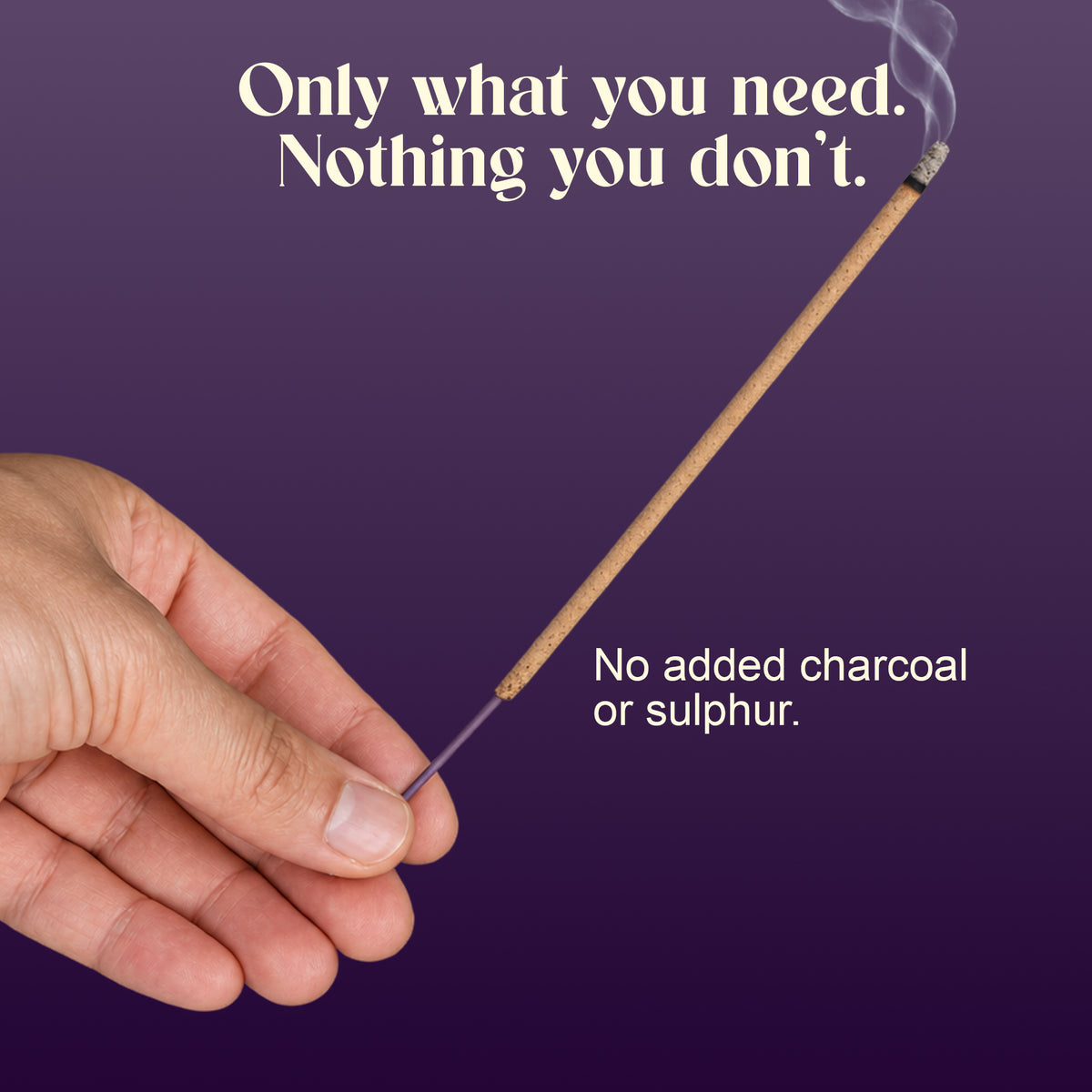 Hand holding a lit Loban incense stick: no added charcoal or sulphur