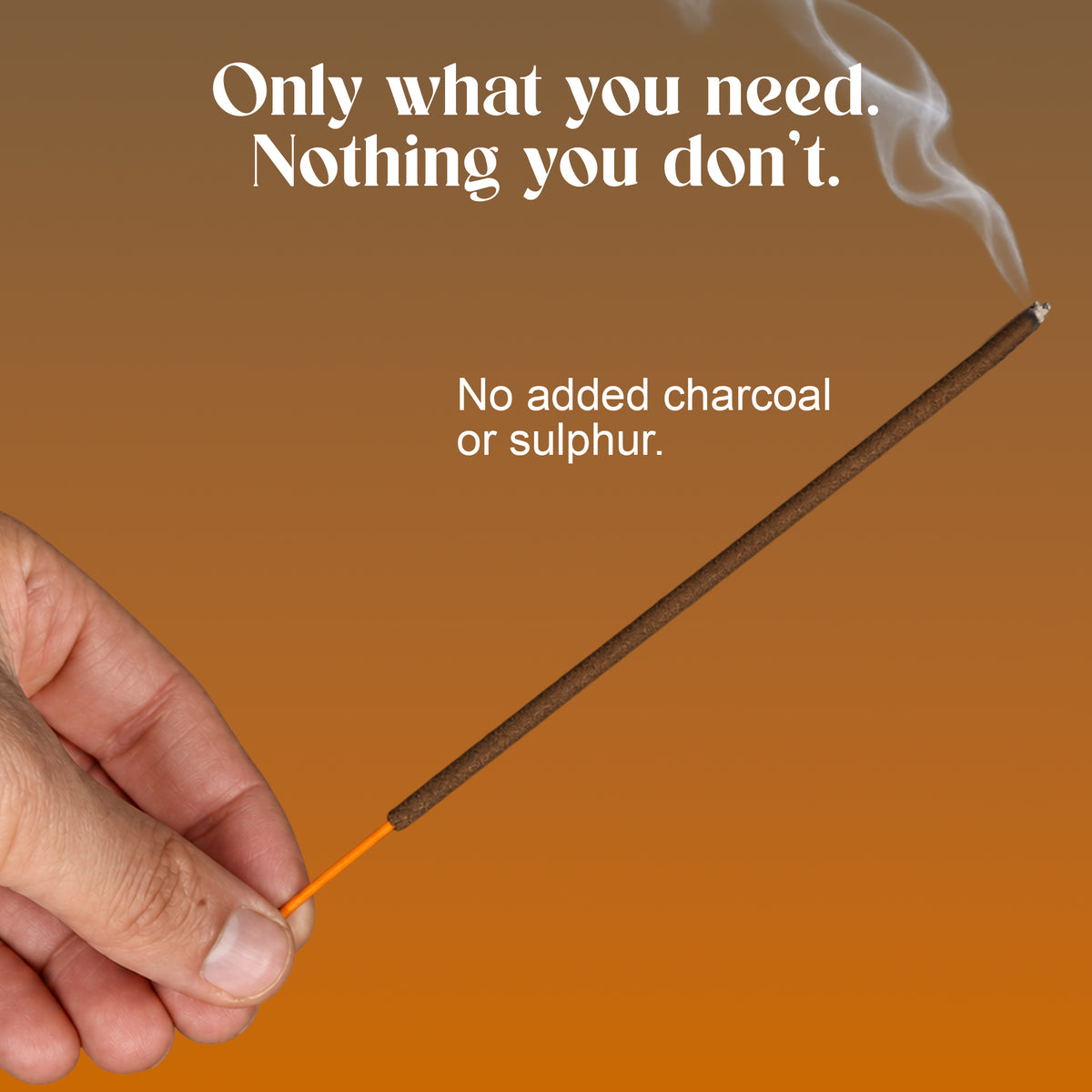 Hand holding a lit Khalira incense stick: no added charcoal or sulphur