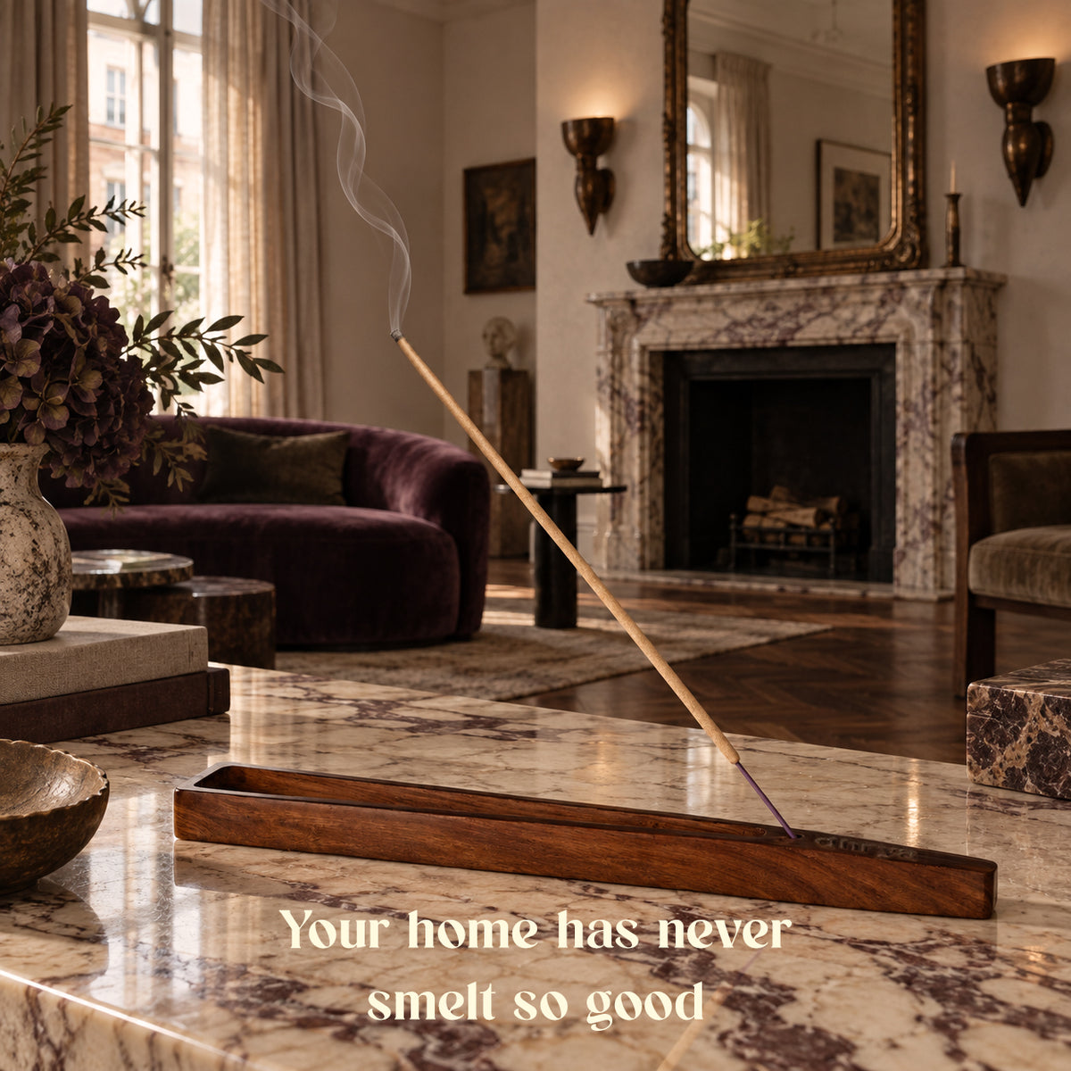Loban incense stick burning in a rosewood holder in a living room with a lit fireplace
